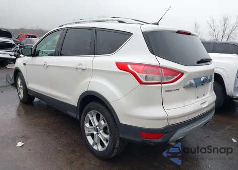 2014 Ford Escape Titanium z USA, uszkodzony, nr VIN 1FMCU9J91EUB77770